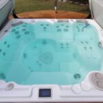 Modern hot tub with clear water and comfortable seating