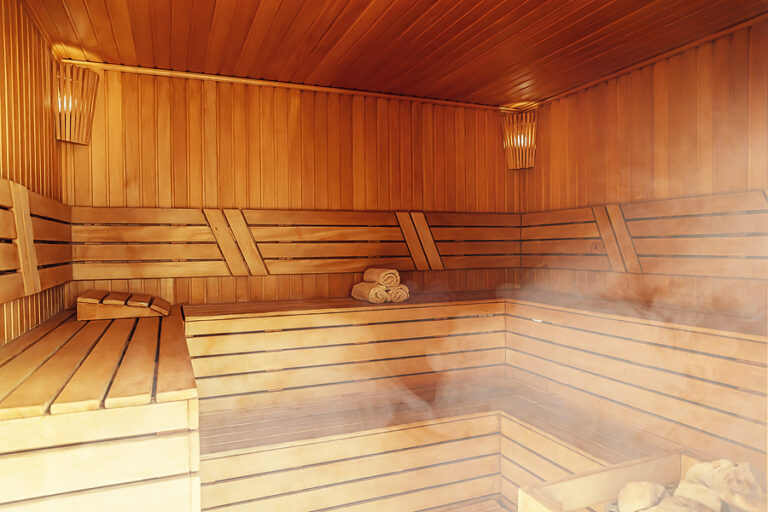 Interior Of Finnish Sauna, Classic Wooden Sauna With Hot Steam.